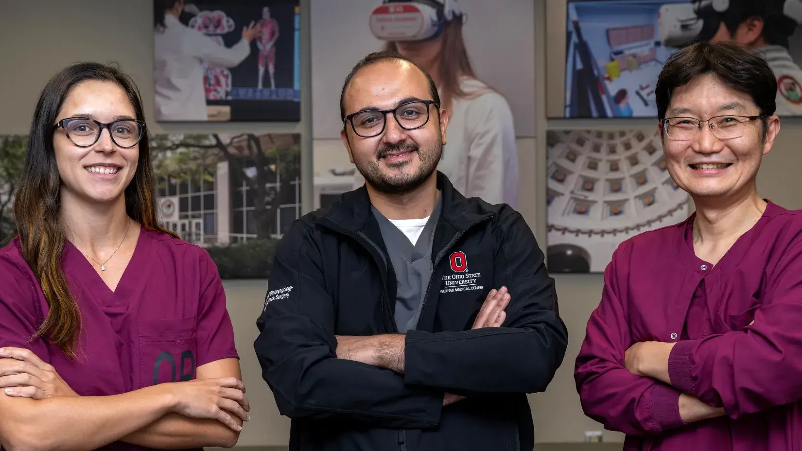 Rebecca Leme Gallardo, Moataz Abouammo and Je Beom Hong smiling and posing together wearing Ohio State branded scrubs.